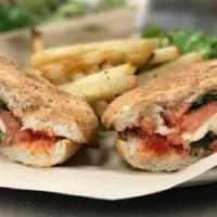 Margarita Sandwich · Fresh mozzarella, basil, tomatoes and herbed olive oil. Served on fresh baked bread with gar...