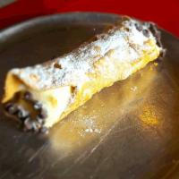 Cannoli · Homemade cannoli shells filled with sweet ricotta filling with chocolate chips
