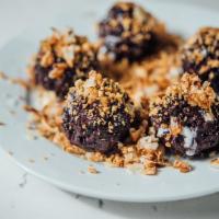 Rice Pudding · Black sweet rice pudding served with crushed baked peanut, baked coconut shaving, sesame see...