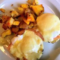 Lox Benedict · Poached eggs and lox over an English muffin with hollandaise sauce.
