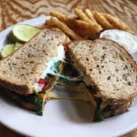 Dominello · Grilled chicken breast, roasted peppers, spinach and mozzarella cheese on multigrain bread. ...