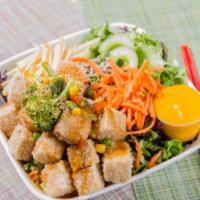 Fried Tofu Salad · Mixed greens topped with thinly sliced apples, carrots, pickled cucumbers, sunflower seeds, ...