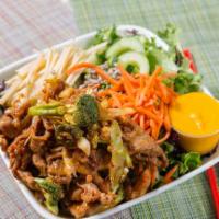 Spicy Pork Salad · Mixed greens topped with thinly sliced apples, carrots, pickled cucumbers, sunflower seeds, ...