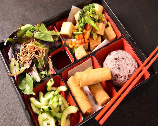 Veggie Tofu Bento · Crispy fried tofu topped with our special tofu sauce. Served with a scoop of rice, side salad, cucumber salad, and 3 veggie spring rolls.