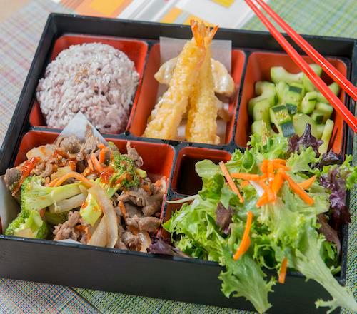Spicy beef bento · Beef stir fried in a spicy sauce with broccoli, carrots, and onion. Served with a scoop of rice, side salad, cucumber salad, 2 potstickers, 2 shrimp tempura. 