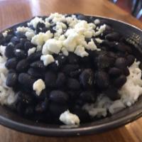 Rice and Beans · White rice, black beans with charred poblanos and queso fresco.