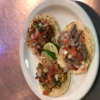 House Tacos · Folded tortilla with a variety of fillings such as meat or beans. 