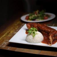 Pescado en Chile y Tamarindo · Whole Red Snapper, Garlic, Tamarind and Chili Sauce, Mixed Salad and White Rice