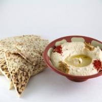 8 oz. Hummus · Chickpeas, olive oil, and tahini, whipped with garlic and lemon juice, served with pita. Veg...