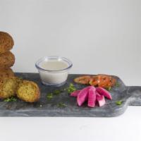 4 Piece Falafel  · Fried chickpea and fava bean fritters seasoned with garlic, onions and spices. Vegan.