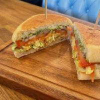 Red Bean Torta · refried red beans, avocado, cabbage, tomato, bermuda onion, pickled vegetables, and garlic s...
