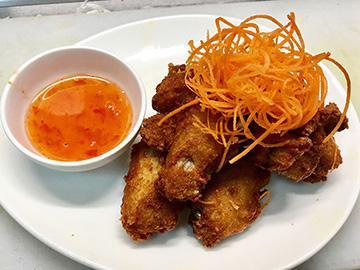 Chicken Wings · Fried marinated wings and sweet chili sauce.