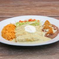 Enchiladas Sulzas · Corn tortillas filled with shredded chicken. Topped with our green sauce and cheese.