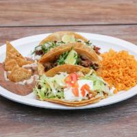 Taco Dinner · Three tacos on flour or corn tortillas with onion, cilantro and your choice of meat. 