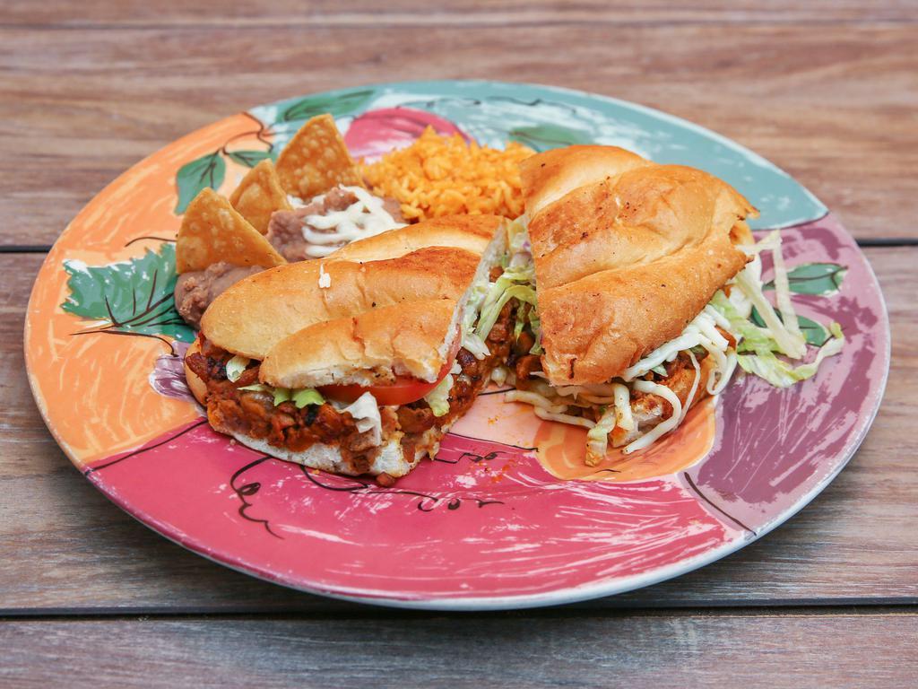 Torta Dinner · Mexican sandwich your choice of meat filled with beans, lettuce, tomato, cheese and sour cream.