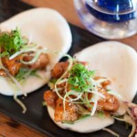 Chicken Nanban Buns · Chicken nanban, cucumbers, scallions and sesame seeds. Served with mixed slaw. Spicy.
