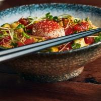 Tuna Yukke Cold Soba · Cubed tuna sashimi, cucumbers and avocado tossed in spicy sesame soy marinade, topped with a...