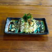 Kani Salad · Crabstick and cucumber mixed with Japanese mayo and spicy miso dressing. Topped with wakame ...