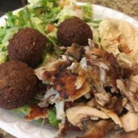 Shawarma and Falafel · Falafel: chickpeas and broad beans mixed with spices and fried. Shawarma: slices of chicken ...