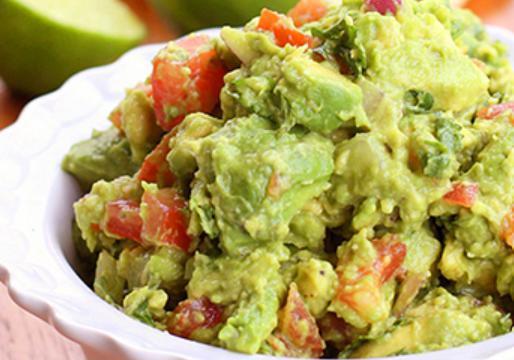 Guacamole Salad · Special recipe guacamole served on a bed of lettuce and tomatoes.