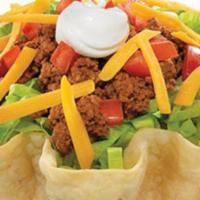 Taco Salad · Crispy flour tortilla shell. Filled with fresh lettuce, tomatoes, cheese, sour cream, and gr...