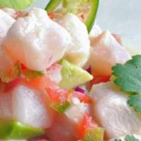 Ceviche Salad · Diced tilapia cooked with lime juice, mixed with peppers, cilantro, tomatoes, and onions. Se...