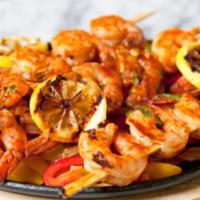 Shrimp Fajitas · Shrimp grilled with zucchini, yellow squash, onions, corn, bell peppers, and celery. Grilled...
