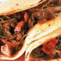 2 Brisket Tacos · Served with rice and beans. Sautéed with tomatoes, onions, sliced poblano, and bell peppers....