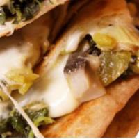 Green Quesadillas · 3 quesadillas served with guacamole and sour cream. Filled with spinach and mushrooms.