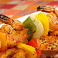 Shrimp Kabob · Grilled shrimp kabob, served with two Jack cheese, and cilantro enchiladas. Topped with gree...