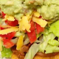 2 Guacamole Tostadas · Served with rice and beans. Layered with beans, cheese, lettuce, and tomatoes.
