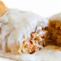 Brisket Chimichanga · Served with rice, beans, and sour cream. Topped with your choice of sauce. A deep-fried extr...