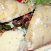 Fajita Chimichanga · Served with rice, beans, and sour cream. Topped with your choice of sauce. A deep-fried extr...