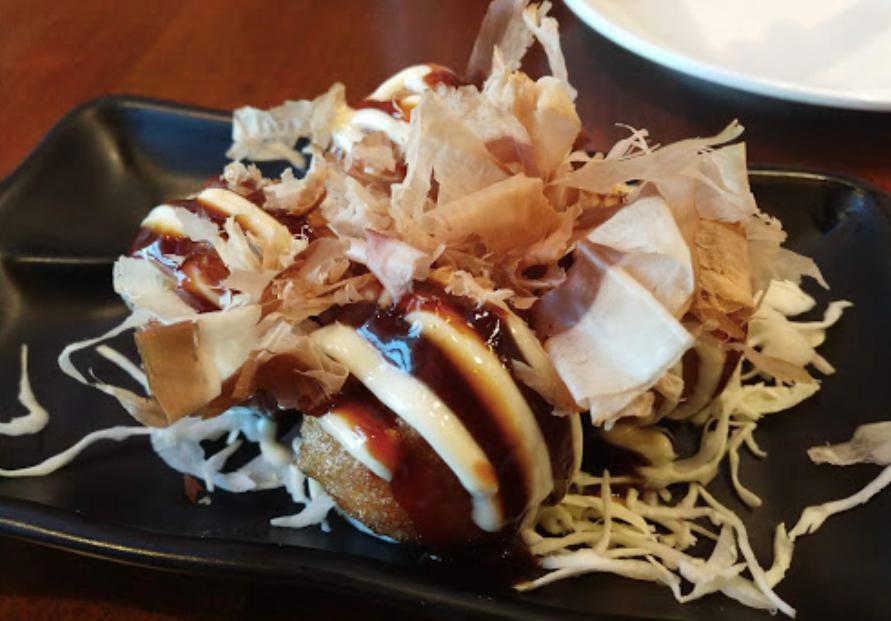 Takoyaki · Japanese snack in the shape of little round balls containing minced octopus.