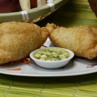 Curry Puff · Ground chicken, potato, onion and curry cooked in puffed pastry. Served with cucumber sauce. 