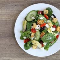 Greek Salad · Fresh greens, artichoke hearts, kalamata olives, roasted red peppers, cucumbers, cherry toma...