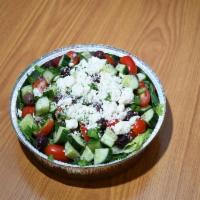 Shepherd's Salad · Tomatoes, cucumbers, red onions, green peppers, feta cheese, parsley and lemon juice.