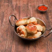 5 Pieces Garlic Knots · A classic snack, our garlic knots are strips of pizza dough tied in a knot, baked, and then ...