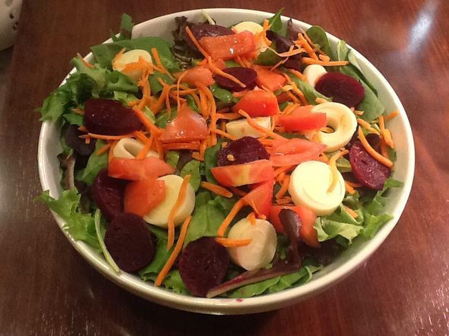 SDV Salad · Fresh mixed greens, hearts of palm, diced tomatoes, beets, shredded carrots, olive oil, and lime juice.