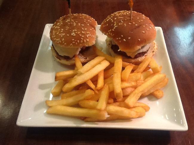 Cheeseburgers · 2 cheeseburger sliders with French fries.