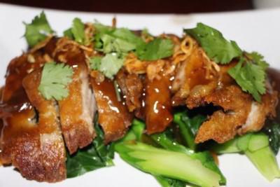 9b. Tamarind Duck · Roasted half duck with pepper, ginger and pineapple in a tamarind sauce.
