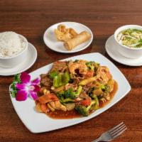 D - Kung Pao Triple · Chicken, beef, shrimp and vegetables stir fried with a spicy brown sauce and topped with pea...