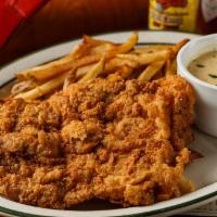 Chicken Fried Chicken · Chicken fried chicken served with Floyd's cream gravy & mashed potatoes.