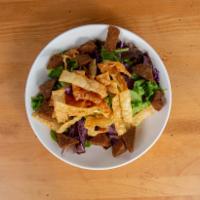 Thai Tofu · shredded red cabbage, bell pepper, carrot, edamame, spring mix and scallions, served with ho...