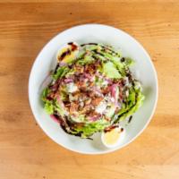 Baby wedge · Baby iceberg lettuce, smoked bacon, farm egg, pickled red onion, Blue cheese, balsamic syrup...