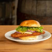 Hoosier Classic Tenderloin Sandwich · An Indiana staple. hand-breaded pork cutlet served with chow chow, shredded lettuce, red oni...