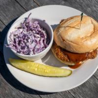 Vegan Hot Seitan Sandwich · Three Carrots seitan, Nashville-style and horseradish pickles