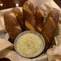 Bavarian Pretzels · Served with bourbon grain mustard. Add queso cheese for an additional charge. Vegetarian.