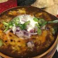 Chili · Topped with cheddar cheese, sour cream and red onion and served with tortilla chips. Gluten ...