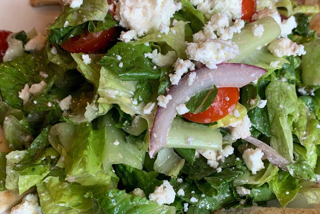 Greek Salad · Romaine, tomato, red onion, feta cheese, Kalamata olive, cucumber and Greek vinaigrette. Served with warm pita bread. Vegetarian.